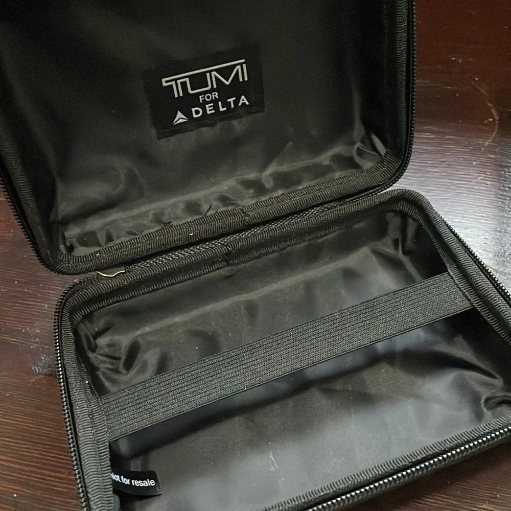 TUMI Silver Travel Size Hard Shell Case With Sturdy Black Zipper & Inner Elastic